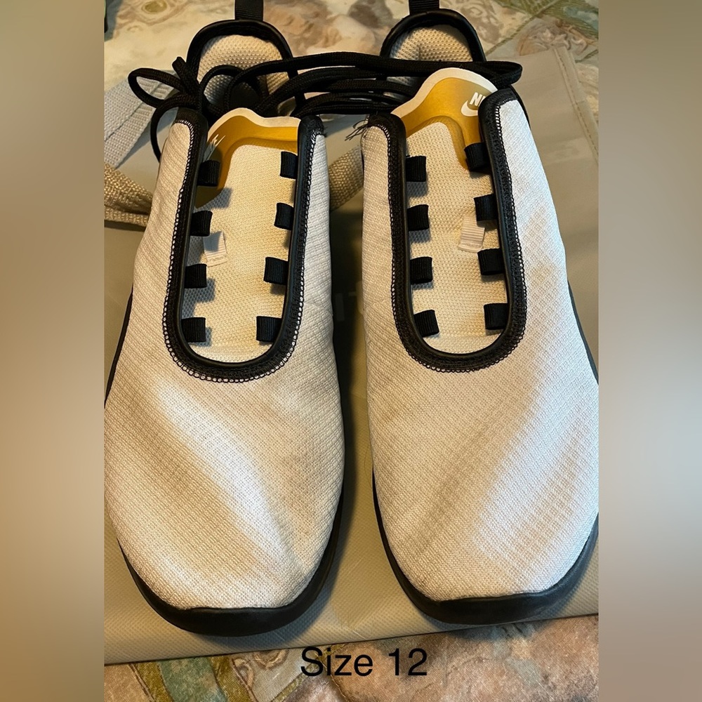Nike air men’s size 12. White with black and gold swoosh